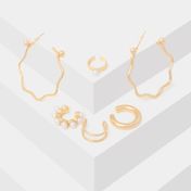 Set de aretes y ear cuff  x9 dorados